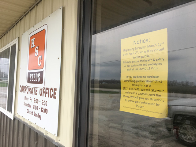 Signs to call and wait for hands-off delivery are not uncommon now in farm country. Kitchen Seeds in Arthur, Illinois, is among the businesses taking extra steps to deliver seed products safely. (DTN photo by Pamela Smith) 